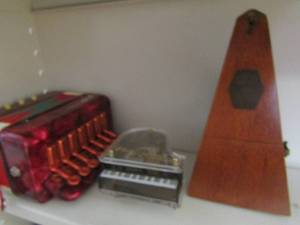 lot 275 image: Seth Thomas clock and Goodin accordion musical piano plus metronome de maelzel