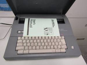 lot 343 image: Smith Corona SL 57S typewriter with users manual