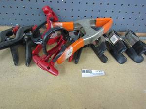 lot 18 image: 12 assorted metal and plastic clamps