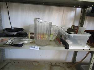 lot 123 image: Kitchen lot- Oneida bread knife, Various knives, tongs, slicer, spice organizer cutting board pans and tea pitcher