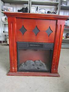 lot 112 image: Twin star plug in heater faux wood 120 volts 30.5t 29long