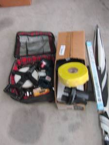 lot 145 image: Drain grategutters battery, drywall tape, tape measure, First aid kit, flashlight ryobi flashlight no battery