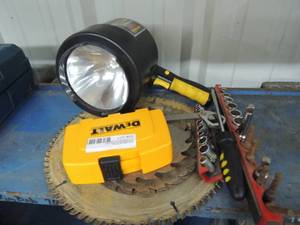 lot 23 image: Large flashlight, socket set and circular saw blades