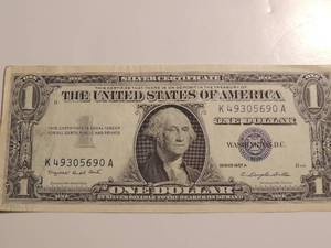 lot 101 image: Silver certificate $1 dollar bill series 1957A crisp blue seal