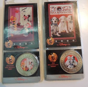 lot 131 image: Disney Decade Coins x 2. Fathers Are People 1951 and 102 Dalmatians 2000