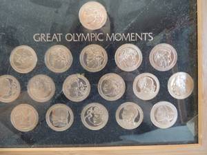 lot 177 image: Great Olympic Moments Coins set framed 17 coins and coins CONSIST OF OLYMPICS 1-5, 7,8,19,1,12,15,16,17,18,20 and Winter 2 & 10