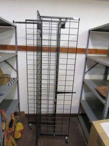 lot 37 image: BLACK METAL RETAIL DISPLAY RACK ON WHEELS.