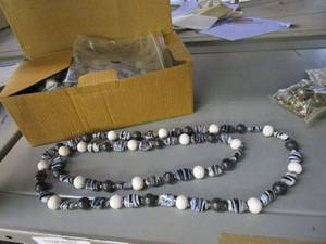 lot 19 image: LOT OF HAND BEADED NECKLACES NEW IN PACKAGING AND BAGS OF BEADS.&nbsp