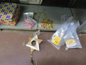 lot 54 image: HAND PAINTED BIRDS IN BOXES, BAGS OF BEADS, HAND PAINTED LOT OF SMALL ANIMALS, BELL HANGINGS, WREATH HANGERSDECOR DISPLAY.