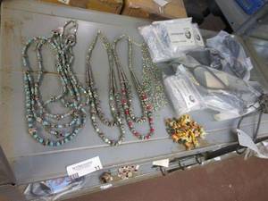 lot 11 image: LOT OF HAND BEADED NECKLACES, SOME NEW IN PACKAGING. HAND PAINTED ANIMAL BEADS, IRON METAL WALL DISPLAY HANGERS.&nbsp