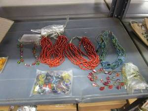 lot 75 image: LOT OF NECKLACES AND BAG OF RINGS.&nbsp