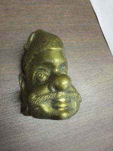 lot 83 image: BRASS FACE