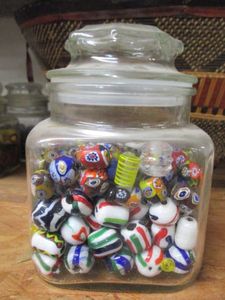 lot 123 image: GLASS JAR FILLED WITH COLORFUL GLASS BEADS