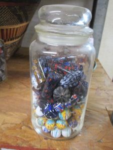 lot 132 image: GLASS JAR FILLED WITH MIXED BEADS