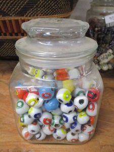 lot 141 image: GLASS JAR FILLED WITH BEADS