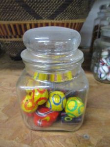 lot 144 image: GLASS JAR WITH COLORFUL BEADS