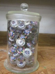 lot 178 image: GLASS JAR FILLED WITH GLASS BEADS. BEADS HAVE COLORFUL PATTERN PAINTED INSIDE. JAR INCLUDED,&nbsp