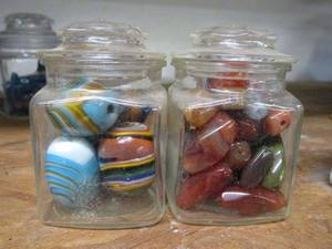 lot 164 image: 2 GLASS JARS FULL OF CHUNKY GLASS BEADS