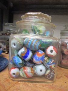 lot 165 image: GLASS JAR OF PAINTED GLASS BEADS. JAR INCLUDED.&nbsp