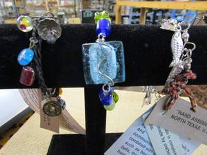 lot 208 image: HAND MADE BRACELETS MADE WITH MATERIALS FROM INDIA. BRACELET STAND NOT INCLUDED. .