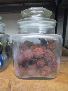 lot 192 image: GLASS JAR WITH BEADS