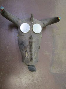 lot 260 image: ANIMAL DECOR WITH HORNS, TONGUE, AND MIRRORED EYES.