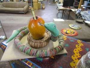 lot 336 image: LONG SNAKE MADE WITH COLORFUL BOTTLECAPS... SMALL COBRA IN A PIECE SITTING ON A HANDMADE WICKER STAND.