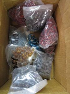 lot 292 image: MIXED LOT OF GLASS BEADS IN PACKAGING, HAND MADE IN INDIA