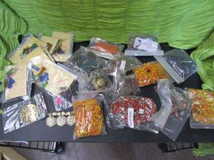 lot 319 image: LOT OF MIXED NECKLACES AND EARRINGS. MOST NEW IN PACKAGING. ALL BEADS ARE MADE IN INDIA.