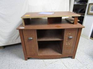 lot 426 image: WOOD ENTERTAINMENT CENTER, HAS SOME BROKEN PIECES. TOP IS REMOVABLE.
