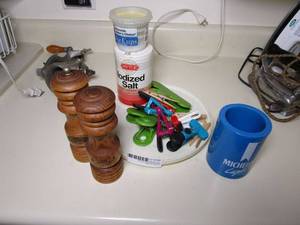 lot 199 image: WOODEN SALT &amp PEPPER GRINDERS, BAKING CUPS, SALT, BAG CLIPS, INSULATED DRINK SLEEVE