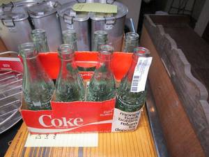 lot 89 image: VINTAGE 6 PACK OF COCA COLA BOTTLES