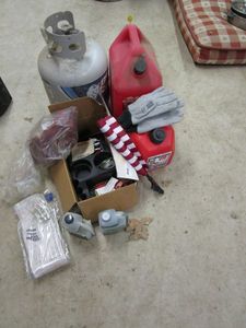 lot 54 image: PROPANE TANK, GAS CANS, FLAGS, OIL &amp MORE