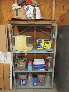lot 21 image: SHELF AND ALL CONTENTS INCL. MOTORCYCLE WHEEL CHOCK NEW IN BOX, ICE CHEST, VINTAGE KENMORE HUMIDIFIER