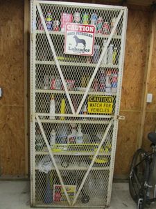 lot 57 image: LARGE METAL LOCKING CABINET W MESH SECURITY SCREEN (CONTENTS NOT INCLUDED)