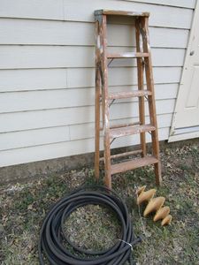 lot 411 image: 2 WOODEN LADDERS, DRIP IRRIGATION HOSE, WOODEN DECOR