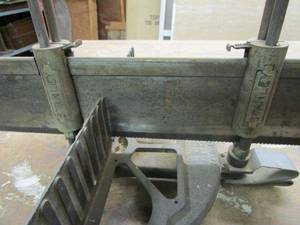 lot 273 image: ANTIQUE CAST IRON STANLEY MITRE BOX WITH ORIGINAL SAW, PATENTED 1904