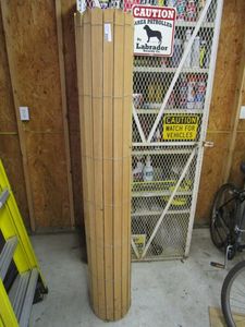 lot 44 image: WOOD PLANKS ATTATCHED AND ROLLED, CAN BE USED AS PRIVACY FENCE OR MATRESS SUPPORT