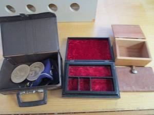 lot 129 image: MULTIPLE CASES, CROWN ROYAL BAG, LEATHER NOTEBOOK WITH BUFFALO NICKLE AS BUTTON