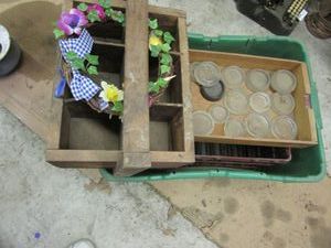 lot 102 image: ANTIQUE WOODEN MILK CARRIER, METAL MILK CRATE &amp GLASS LIDSJARS OR ASHTRAYS