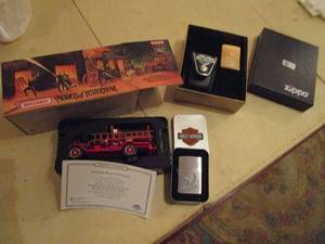 lot 223 image: MATCHBOX 1916 FORD MODEL T FIRE ENGINE, HD SILVER COLOR ZIPPO, GOLD COLOR ZIPPO W LEATHER CARRYING POUCH