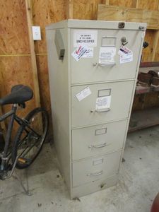lot 423 image: FILE CABINET INCLUDING ALL CONTENTS- HARLEY DAVIDSON HARD HAT, TEXAS FLAG, GLOVES, ETC.