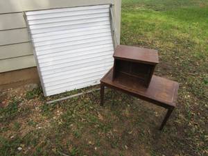 lot 415 image: MID CENTURY 2 TIER SIDE TABLE-NEEDS REPAIRS, SMALL TIN ROLL DOOR-NEEDS REPAIR