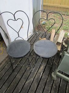 lot 416 image: PAIR OF TWISTED LOOP HEART SHAPED ICE CREAM PARLORBISTRO CHAIRS, ONE HAS DAMAGE ON BOTTOM