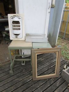 lot 440 image: MID CENTURY TYPRWRITER TABLE W FOOTBRAKE &amp RUBBERMAID TOP, ANTIQUE PICTURE FRAME 16X20, ANTIQUE IN-WALL GAS HEATER