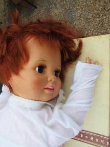 lot 68 image: Doll with clothes, blanket and pillow