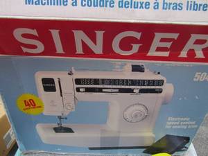 lot 87 image: Singer sewing machine in original box and smart scissors in original box