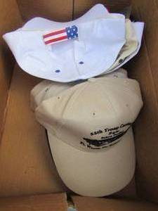 lot 104 image: Box of snap back caps