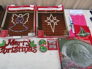 lot 114 image: Light up Christmas yard art, christmas stockings,  Door hangers, ribbon mantle dcor cookie cannisters and christmas cards