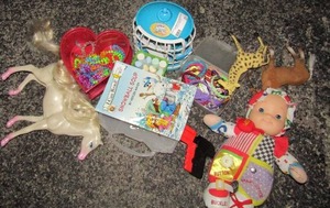 lot 23 image: Kids lot- baby dolls, ponies, chalk, coloring book